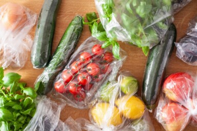 An assortment of vegetables wrapped in plastic packaging