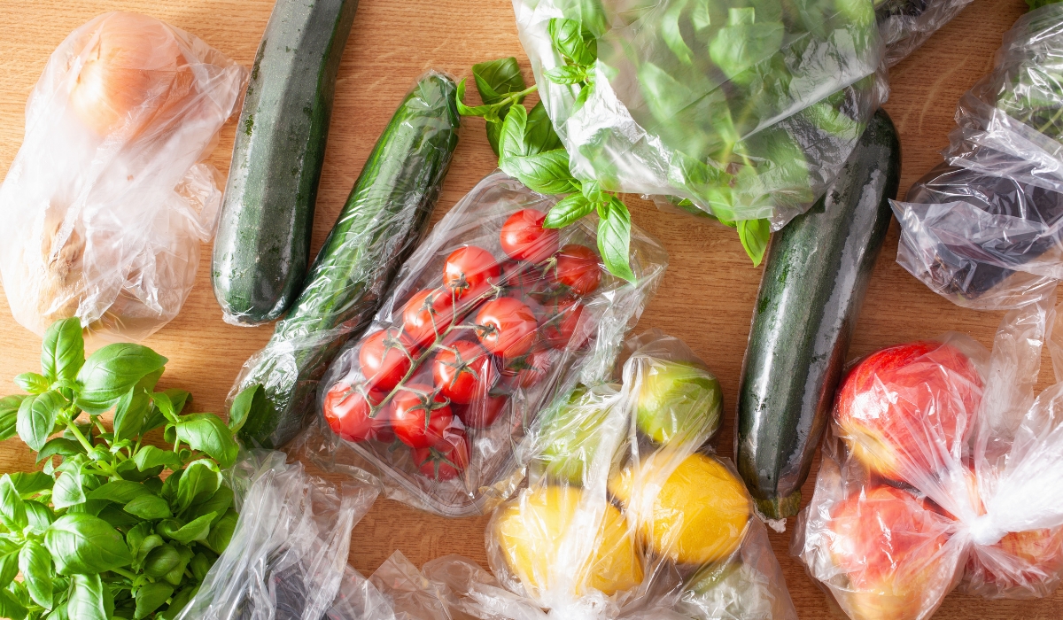 An assortment of vegetables wrapped in plastic packaging