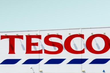 The TESCO sign. Image courtesy of Simone Hutsch via Unsplash.