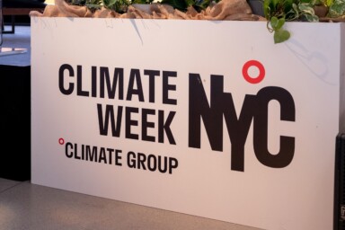 'Climate Week NYC, Climate Group' reads on a square white stand. Courtesy of Climate Group