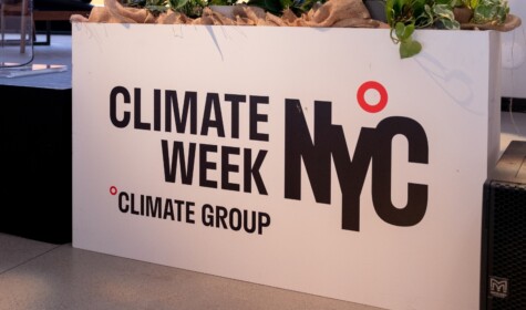 'Climate Week NYC, Climate Group' reads on a square white stand. Courtesy of Climate Group