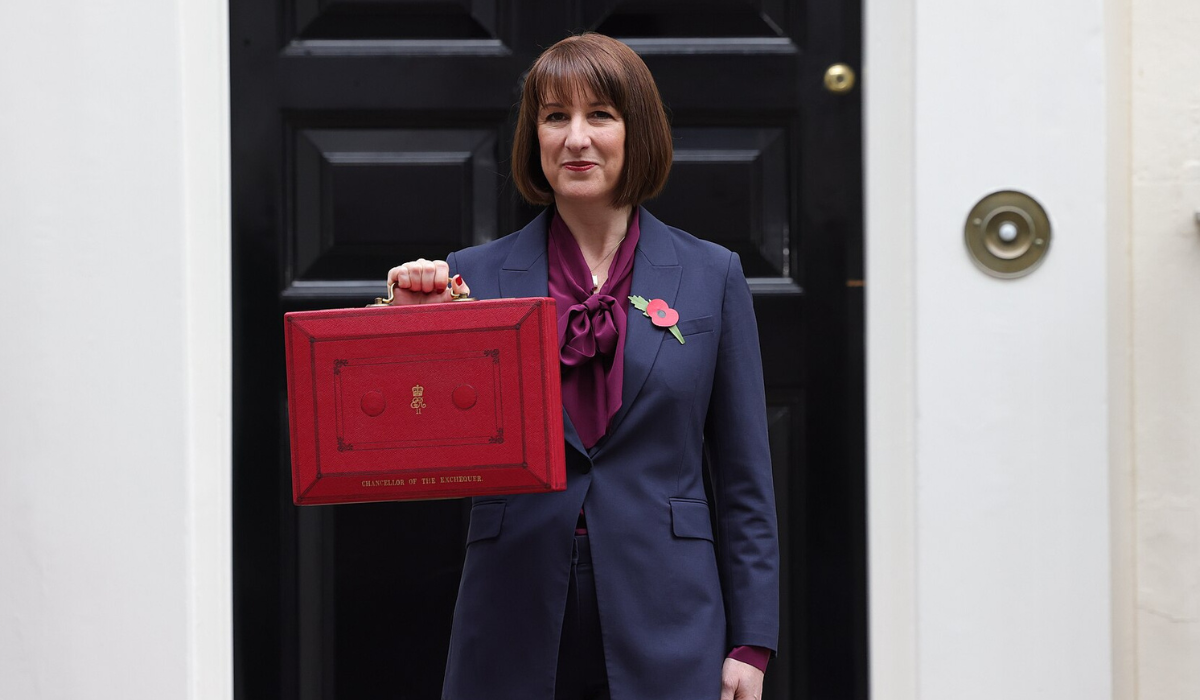 Rachel Reeves, Chancellor of the Exchequer, stands in front of 10 Downing Street holding the red budget briefcase following the announcement of Labour's 2024 budget – picture courtesy of the HM Treasury